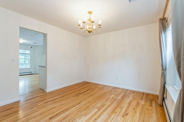 20 S St S, Highland Falls, NY 10928 - empty room featuring baseboard heating, a chandelier, light wood-style floors, and baseboards