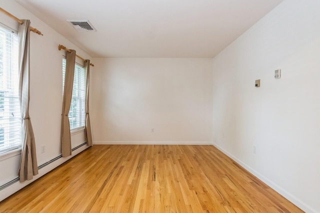 20 S St S, Highland Falls, NY 10928 - spare room with baseboard heating, light wood-type flooring, and baseboards