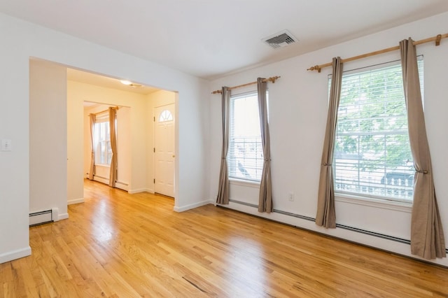20 S St S, Highland Falls, NY 10928 - unfurnished room featuring baseboard heating, light wood-type flooring, and healthy amount of natural light