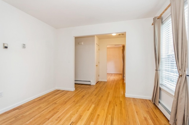 20 S St S, Highland Falls, NY 10928 - empty room with a baseboard heating unit, light wood-style flooring, and baseboards