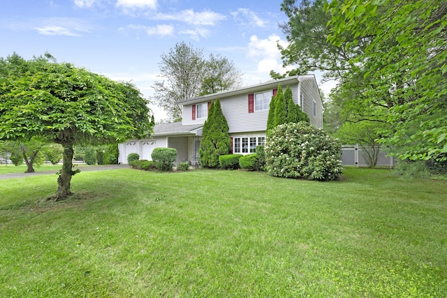 2 Mohican Rd, Newburgh, NY 12550 - view of front facade with a garage and asphalt driveway