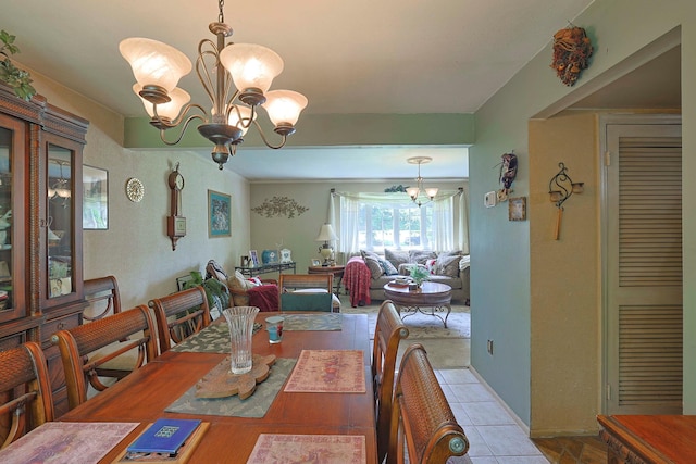 2 Mohican Rd, Newburgh, NY 12550 - dining area featuring a chandelier and tile patterned floors