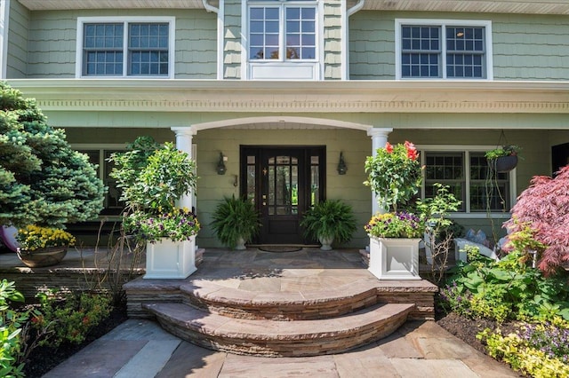 doorway to property featuring a porch