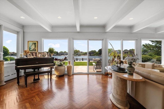 living area featuring a baseboard radiator, beamed ceiling, a water view, recessed lighting, and ornamental molding