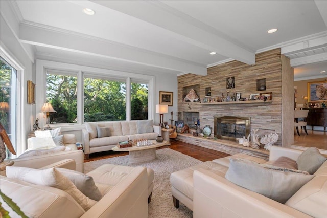 living room featuring beamed ceiling, a fireplace, wood finished floors, crown molding, and recessed lighting