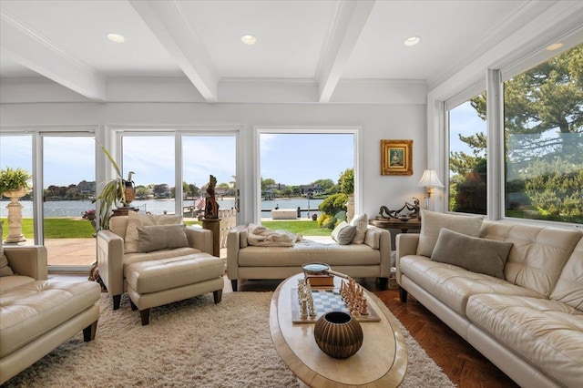 sunroom / solarium with beam ceiling and a water view