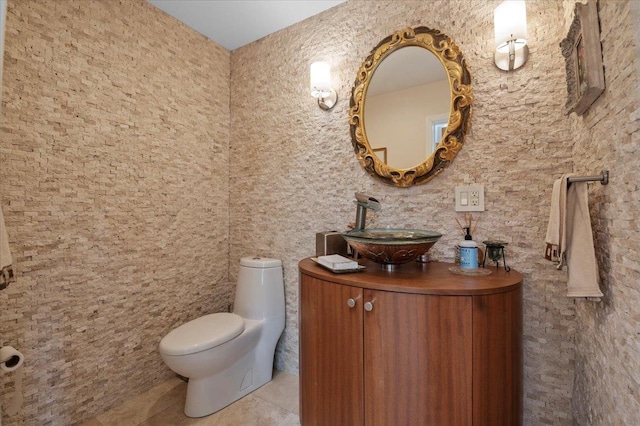 bathroom featuring tile patterned floors, toilet, and vanity