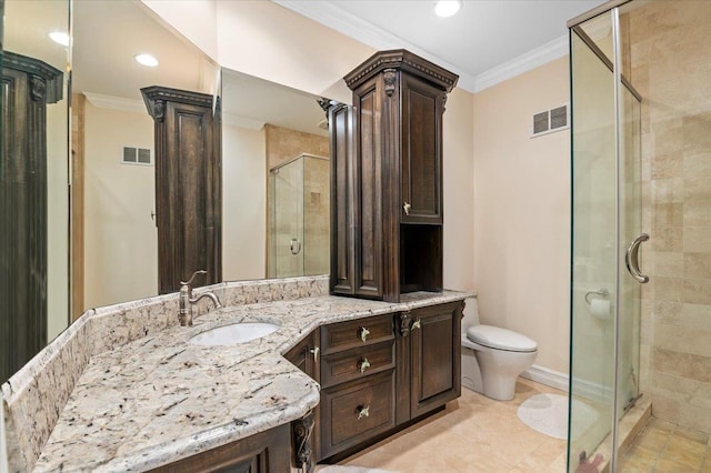 bathroom with ornamental molding, a stall shower, toilet, vanity, and recessed lighting