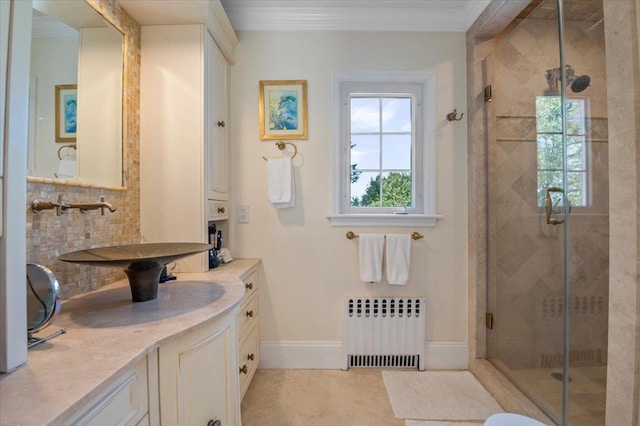 full bath with radiator heating unit, a shower stall, decorative backsplash, baseboards, and crown molding