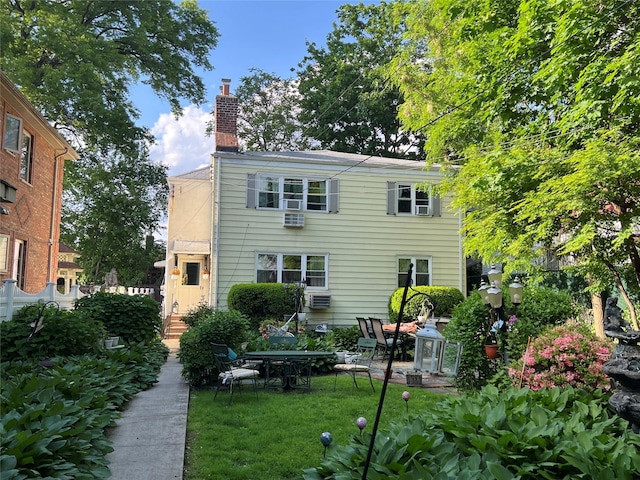 196-19 42nd Rd, Flushing, NY 11358 - back of property with a chimney and a lawn