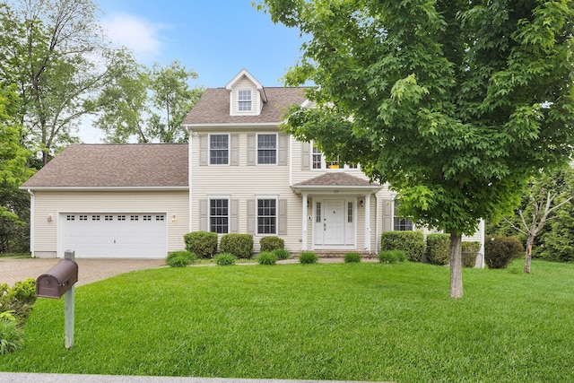 135 Ray Blvd, Poughkeepsie, NY 12603 - colonial inspired home with driveway, a front yard, an attached garage, and a shingled roof