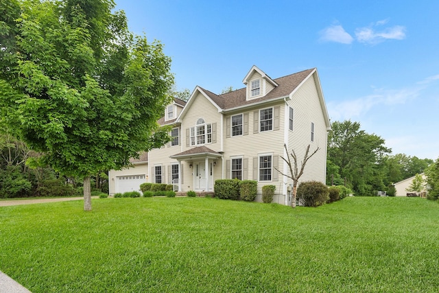 135 Ray Blvd, Poughkeepsie, NY 12603 - colonial inspired home featuring a front lawn, roof with shingles, and an attached garage