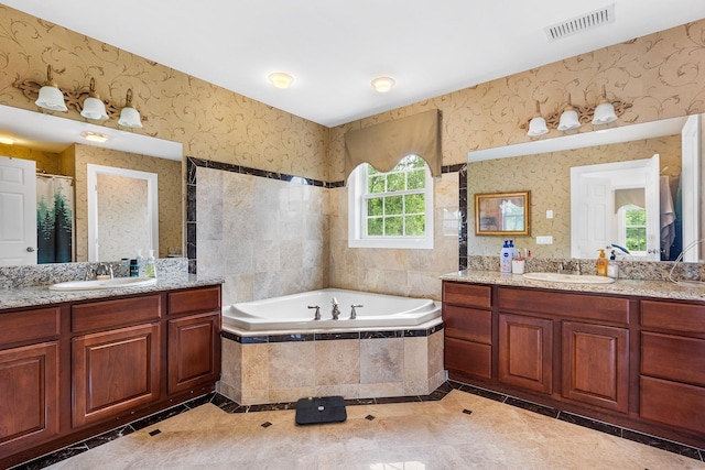 135 Ray Blvd, Poughkeepsie, NY 12603 - full bathroom featuring inlaid floor details, a garden tub, two vanities, and curtained shower
