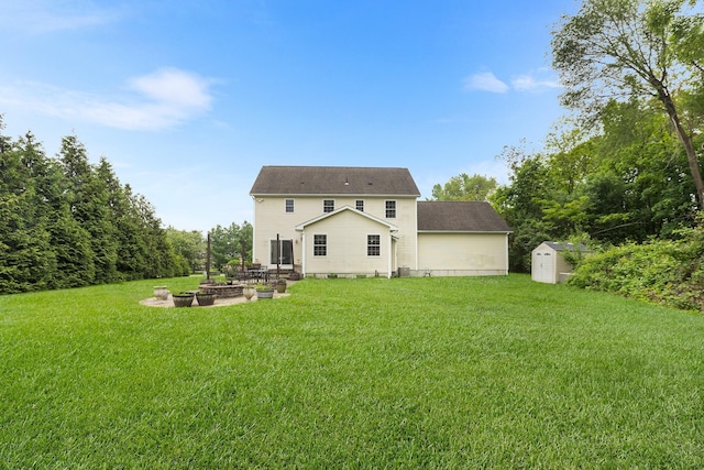 135 Ray Blvd, Poughkeepsie, NY 12603 - back of property featuring a yard, a patio, and an outdoor fire pit