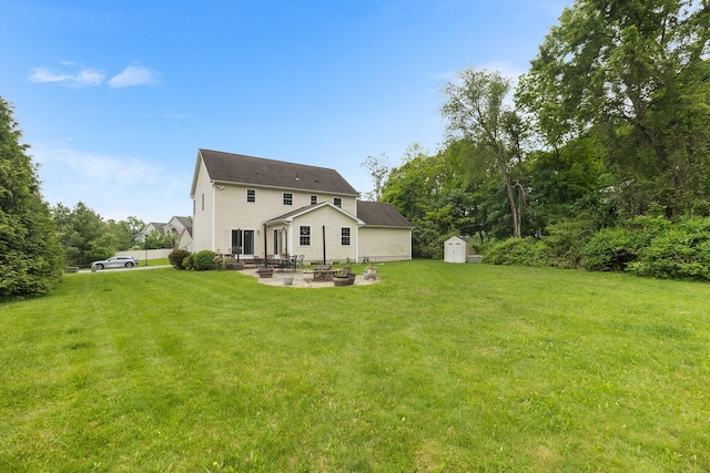 135 Ray Blvd, Poughkeepsie, NY 12603 - rear view of property featuring a patio, a lawn, and an outdoor fire pit