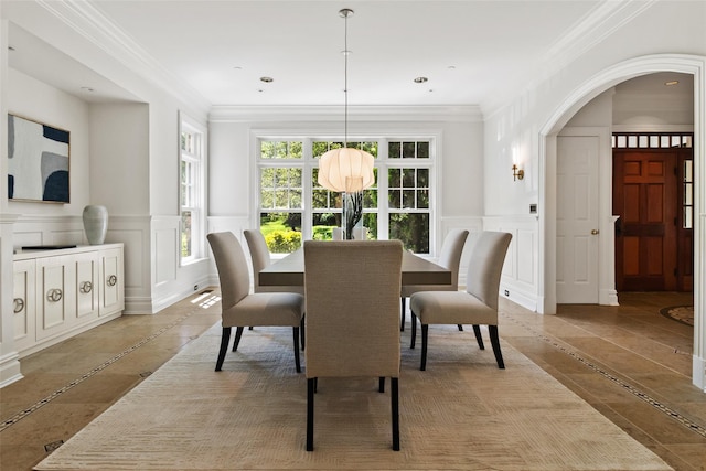 5 Club Way, Mount Kisco, NY 10549 - dining space with inlaid floor details, a decorative wall, arched walkways, ornamental molding, and a wainscoted wall