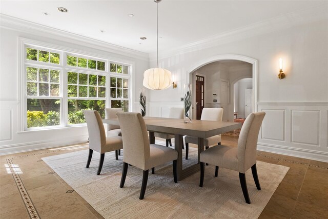 5 Club Way, Mount Kisco, NY 10549 - dining area with arched walkways, a decorative wall, ornamental molding, wainscoting, and light tile patterned floors