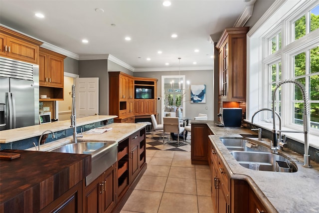 5 Club Way, Mount Kisco, NY 10549 - kitchen with a sink, brown cabinetry, light tile patterned floors, recessed lighting, and crown molding