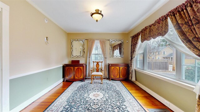 55 Teller Ave, Beacon, NY 12508 - living area with wood finished floors, crown molding, and baseboards