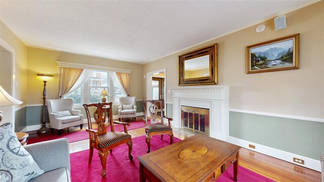 55 Teller Ave, Beacon, NY 12508 - living room with wood finished floors, a glass covered fireplace, and baseboards