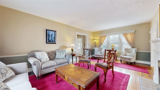 55 Teller Ave, Beacon, NY 12508 - living area featuring wood finished floors and a fireplace with flush hearth