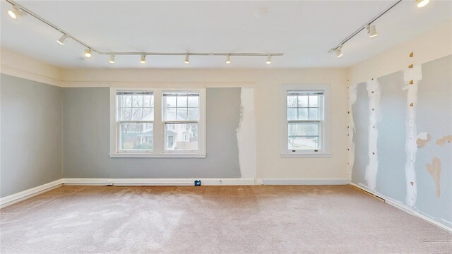 55 Teller Ave, Beacon, NY 12508 - spare room featuring track lighting, carpet floors, and baseboards
