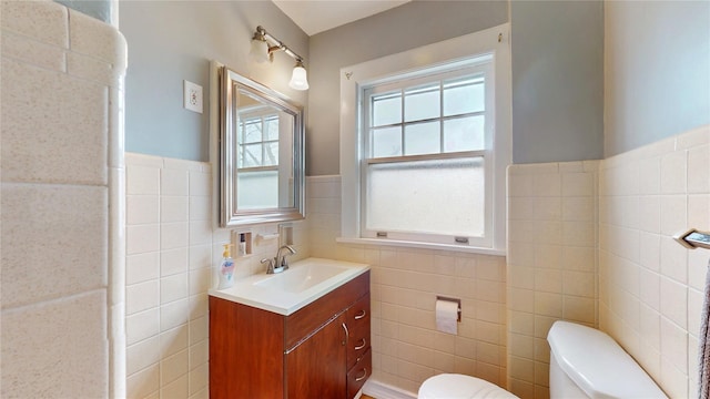 55 Teller Ave, Beacon, NY 12508 - bathroom featuring tile walls, toilet, wainscoting, and vanity