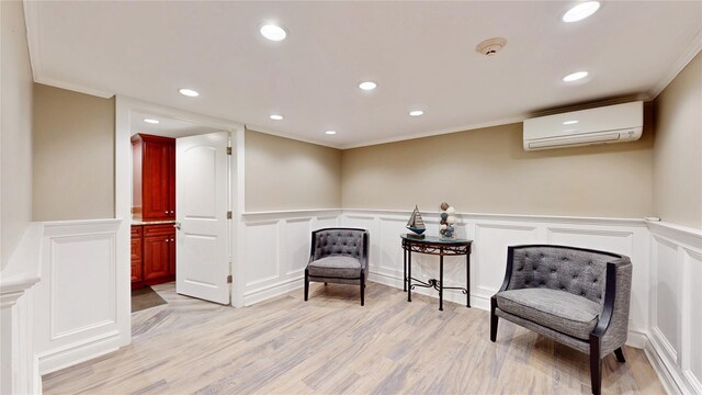 55 Teller Ave, Beacon, NY 12508 - living area with a decorative wall, a wall unit AC, light wood finished floors, crown molding, and wainscoting
