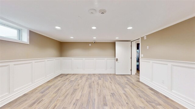 55 Teller Ave, Beacon, NY 12508 - empty room featuring a decorative wall, crown molding, recessed lighting, and light wood finished floors