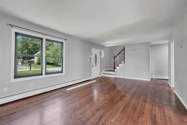 54 Capital Dr, Washingtonville, NY 10992 - unfurnished living room with a baseboard heating unit, wood finished floors, stairway, and baseboards