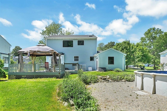 54 Capital Dr, Washingtonville, NY 10992 - rear view of property featuring a gazebo, a wooden deck, and a yard