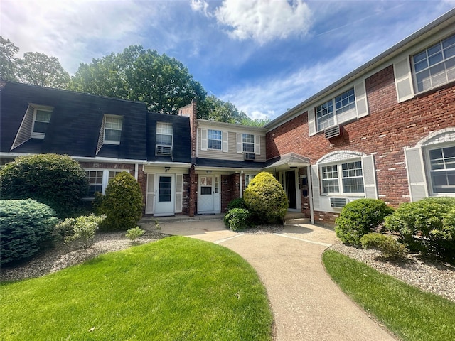 202 Doxbury Ln, Suffern, NY 10901 - view of front facade with brick siding and a front lawn