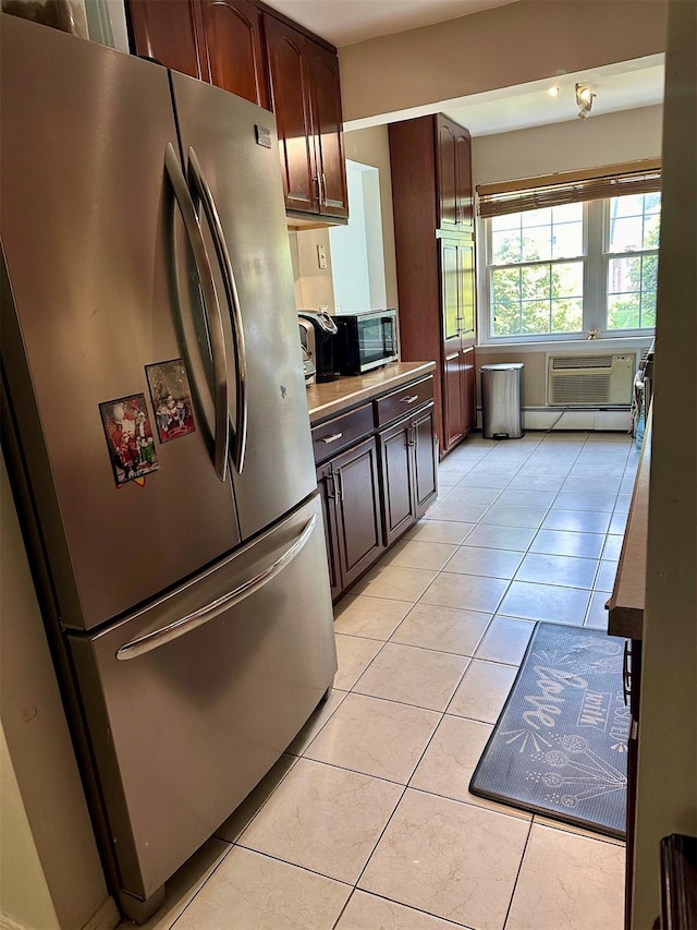 202 Doxbury Ln, Suffern, NY 10901 - kitchen with stainless steel appliances, light tile patterned flooring, and baseboard heating