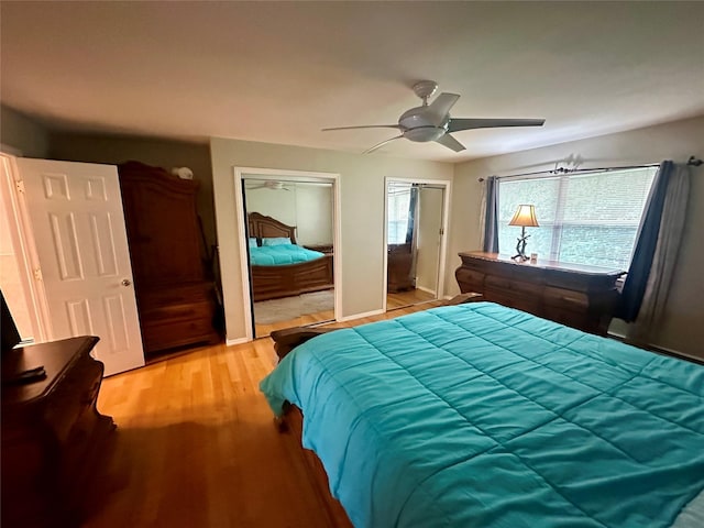202 Doxbury Ln, Suffern, NY 10901 - bedroom featuring two closets, light wood-type flooring, and ceiling fan