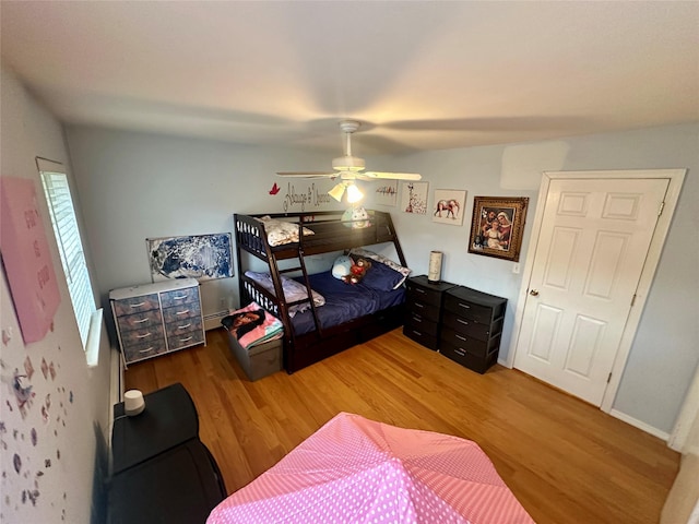 202 Doxbury Ln, Suffern, NY 10901 - bedroom featuring light wood finished floors, ceiling fan, and a baseboard radiator