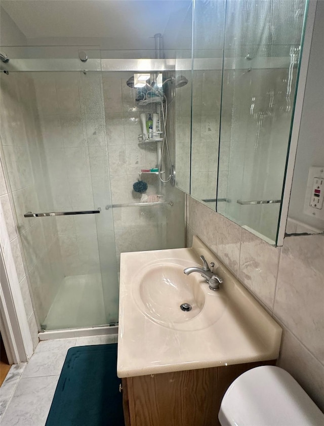 202 Doxbury Ln, Suffern, NY 10901 - full bath featuring vanity, a shower stall, toilet, and tile walls