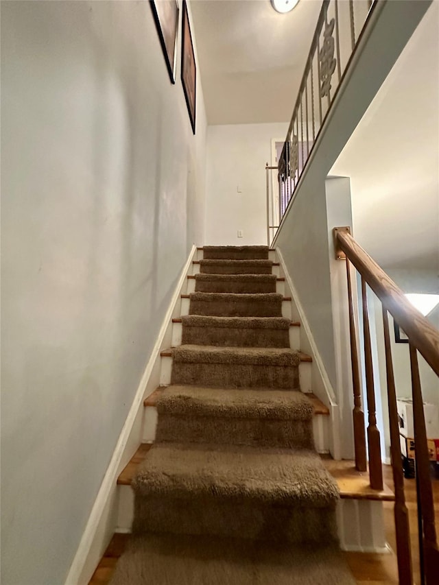 202 Doxbury Ln, Suffern, NY 10901 - stairway with baseboards and wood finished floors