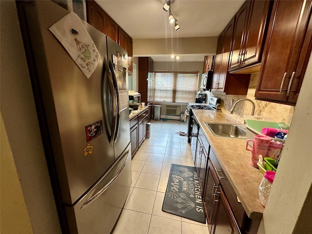 202 Doxbury Ln, Suffern, NY 10901 - kitchen featuring a sink, appliances with stainless steel finishes, light tile patterned flooring, and tasteful backsplash