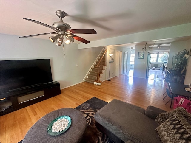 202 Doxbury Ln, Suffern, NY 10901 - living area featuring stairs, ceiling fan, wood finished floors, and baseboards