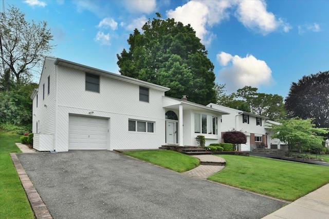 10 Linda Ln, Plainview, NY 11803 - tri-level home with a garage, a front yard, and driveway