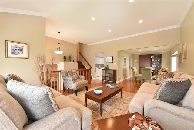 10 Linda Ln, Plainview, NY 11803 - living area featuring crown molding, wood finished floors, stairway, baseboards, and recessed lighting