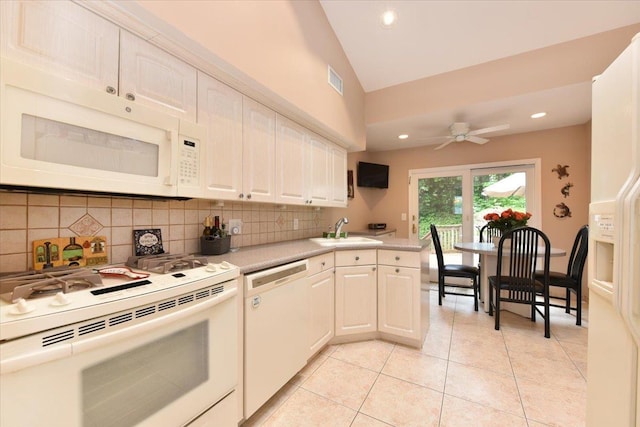 10 Linda Ln, Plainview, NY 11803 - kitchen with white appliances, a sink, backsplash, light countertops, and lofted ceiling