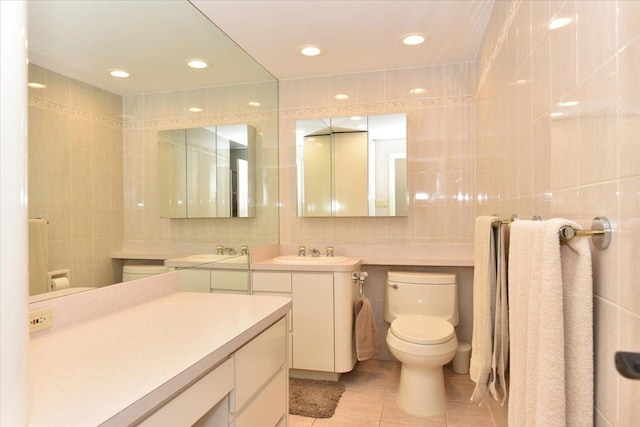 10 Linda Ln, Plainview, NY 11803 - bathroom with tile walls, toilet, tile patterned floors, vanity, and tasteful backsplash