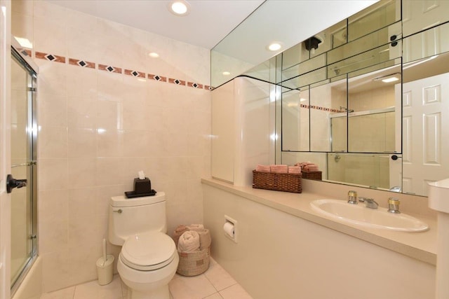 10 Linda Ln, Plainview, NY 11803 - full bath featuring tile patterned flooring, toilet, tile walls, recessed lighting, and vanity