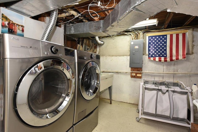 10 Linda Ln, Plainview, NY 11803 - laundry area with electric panel, tile patterned floors, and washer and clothes dryer