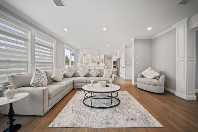 1427 Bellmore Rd, North Bellmore, NY 11710 - living room with ornamental molding, dark wood-style flooring, recessed lighting, and baseboards