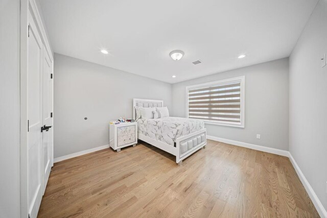 1427 Bellmore Rd, North Bellmore, NY 11710 - bedroom featuring light wood-type flooring, baseboards, and recessed lighting