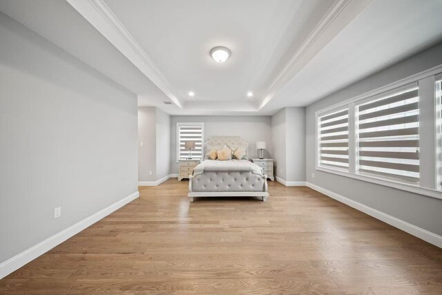 1427 Bellmore Rd, North Bellmore, NY 11710 - bedroom with a raised ceiling, baseboards, light wood-type flooring, recessed lighting, and crown molding