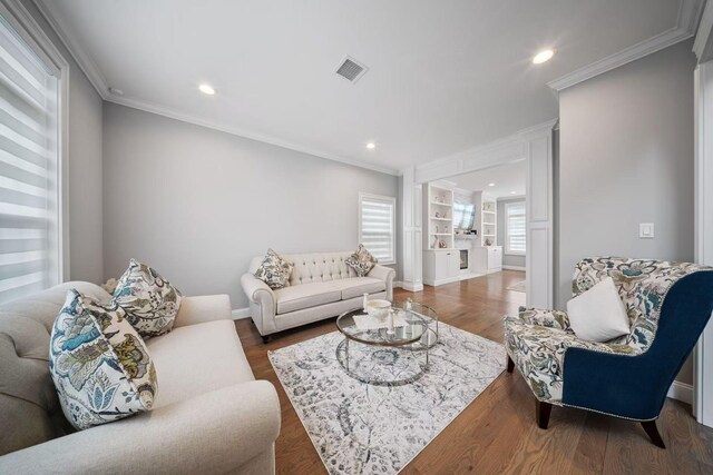 1427 Bellmore Rd, North Bellmore, NY 11710 - living room with crown molding, wood finished floors, recessed lighting, and baseboards