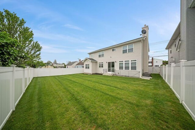 1427 Bellmore Rd, North Bellmore, NY 11710 - back of house with entry steps and central AC unit